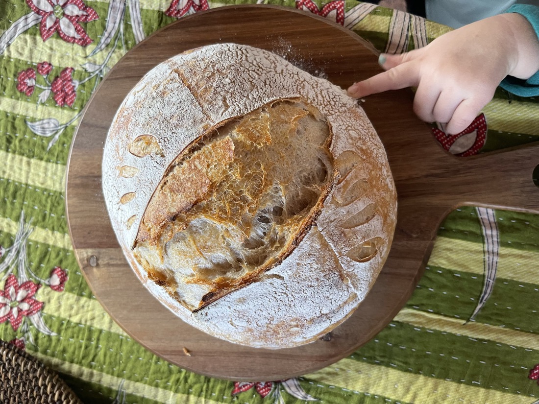 A freshly baked sourdough loaf from The Checkered Apron